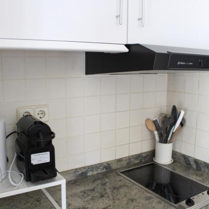 kitchen with coffee machines and kettle